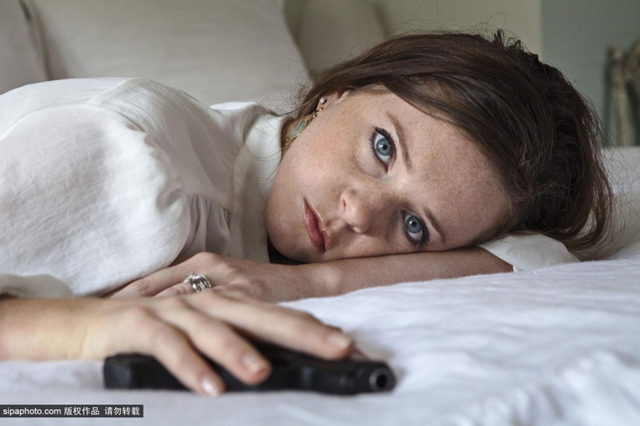 نساء تكساس واقتناء الأسلحة النارية بعدسة مصورة 