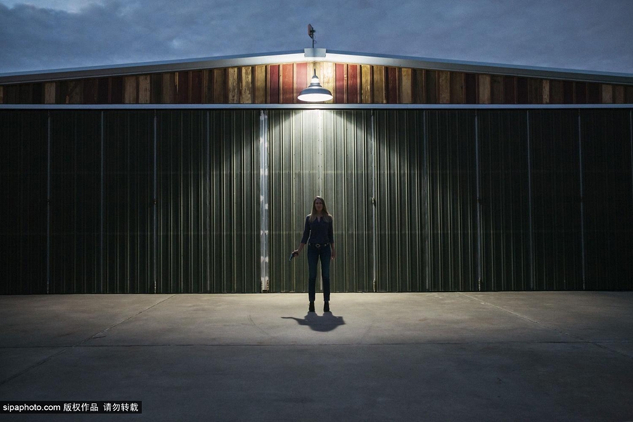 نساء تكساس واقتناء الأسلحة النارية بعدسة مصورة 