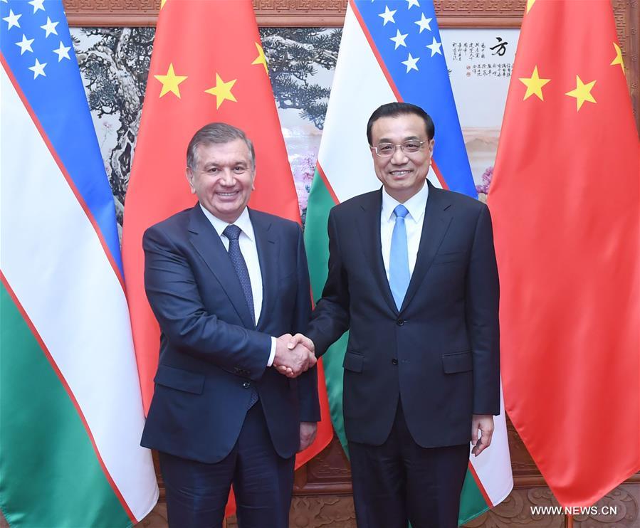الصين وأوزبكستان تتعهدان بتعزيز التعاون