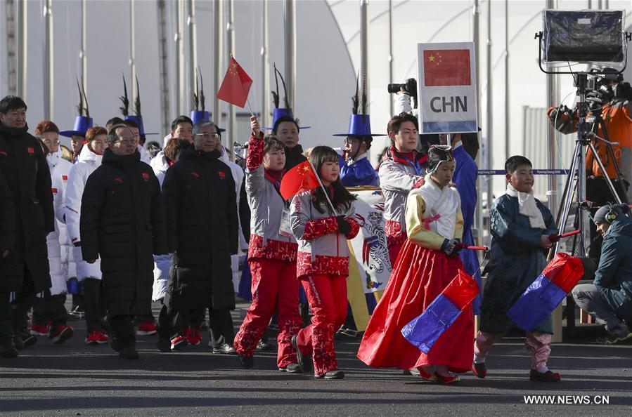 العلم الصيني يرفع في قرية الألعاب الأولمبية الشتوية في قانغ نيونغ