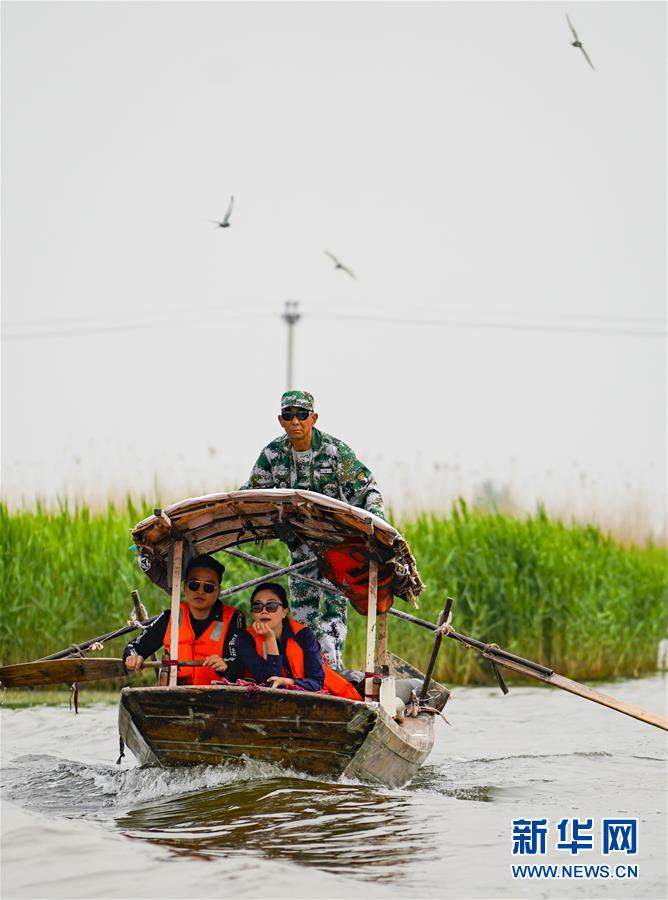 بالصور: مناظر بحيرة باي يانغ ديان تجذب الزوار