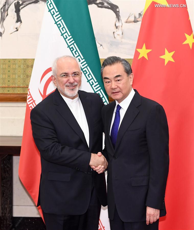 عضو مجلس الدولة الصيني يلتقي وزير الخارجية الايراني في بكين