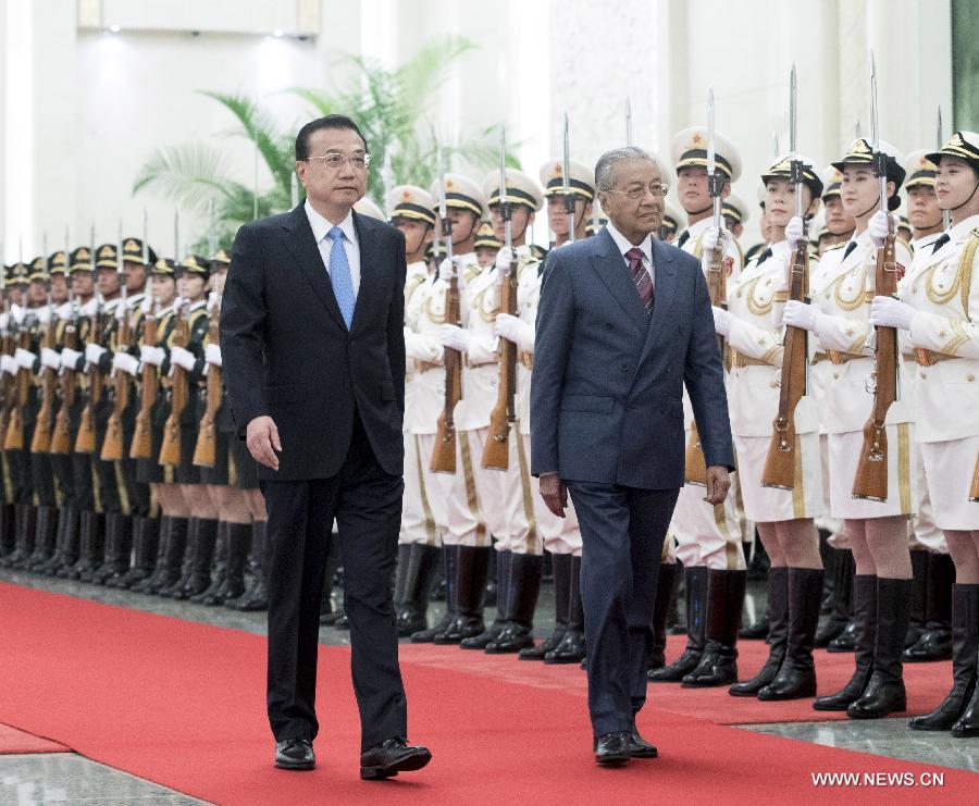 مقالة : الصين تتعهد بالنهوض بالعلاقات مع ماليزيا إلى مستوى جديد