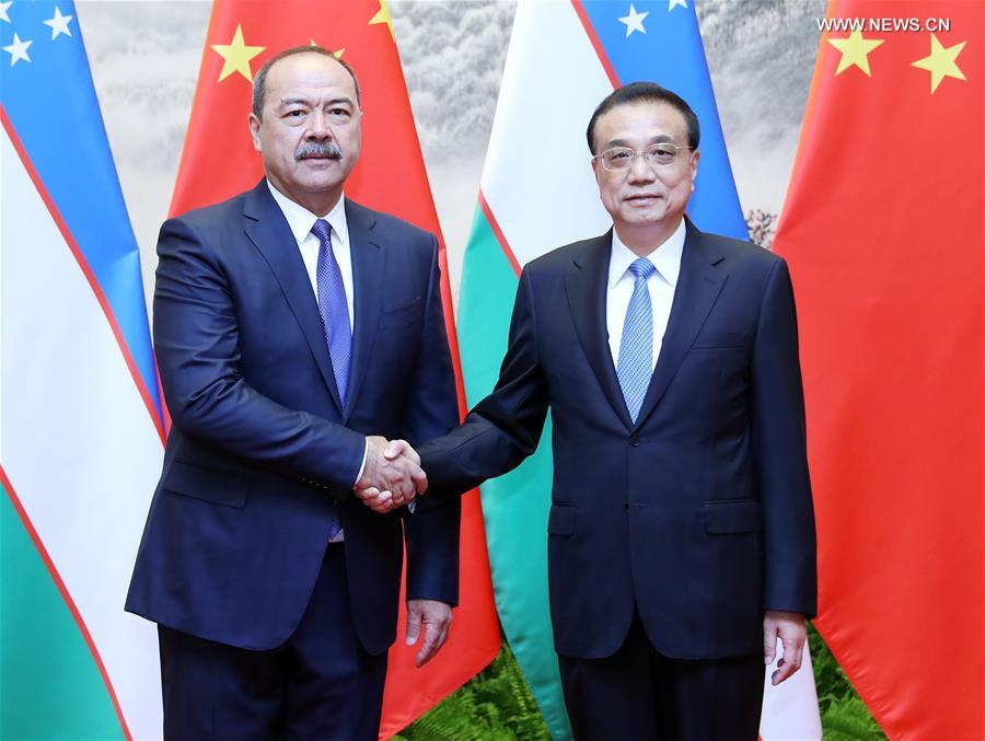 رئيس مجلس الدولة الصيني يعقد محادثات مع نظيره الأوزبكي لتعزيز العلاقات الثنائية
