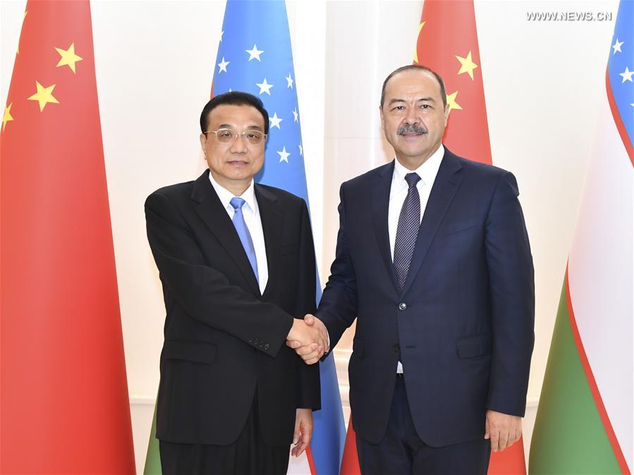 تقرير إخباري: رئيس مجلس الدولة الصيني يدعو الصين وأوزبكستان إلى صياغة نمط جديد للتعاون العملي
