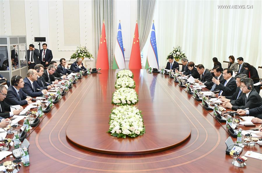 تقرير إخباري: رئيس مجلس الدولة الصيني يدعو الصين وأوزبكستان إلى صياغة نمط جديد للتعاون العملي